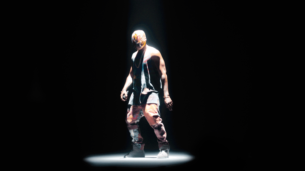 kanye standing with mask on